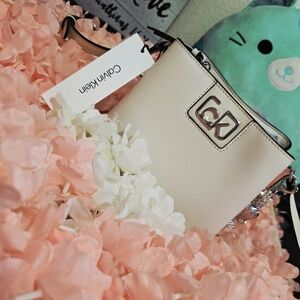 Calvin Klein Creamy White Crossbody Bag With Silver Accents And Cute Charms
